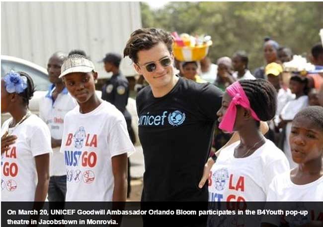 Orlando Bloom with Liberian women
