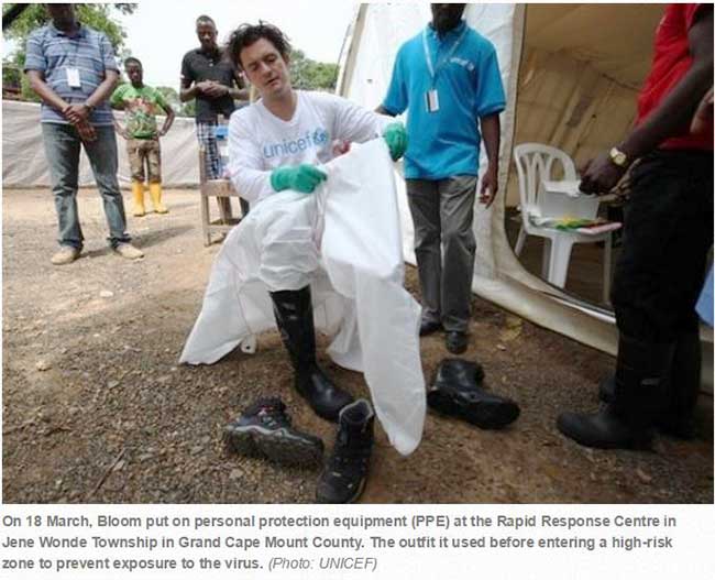 Orlando Bloom putting on personal protection equipment