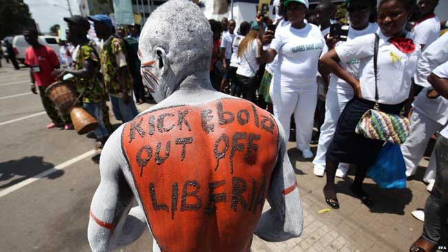 Liberian Man with ebola sign on his back